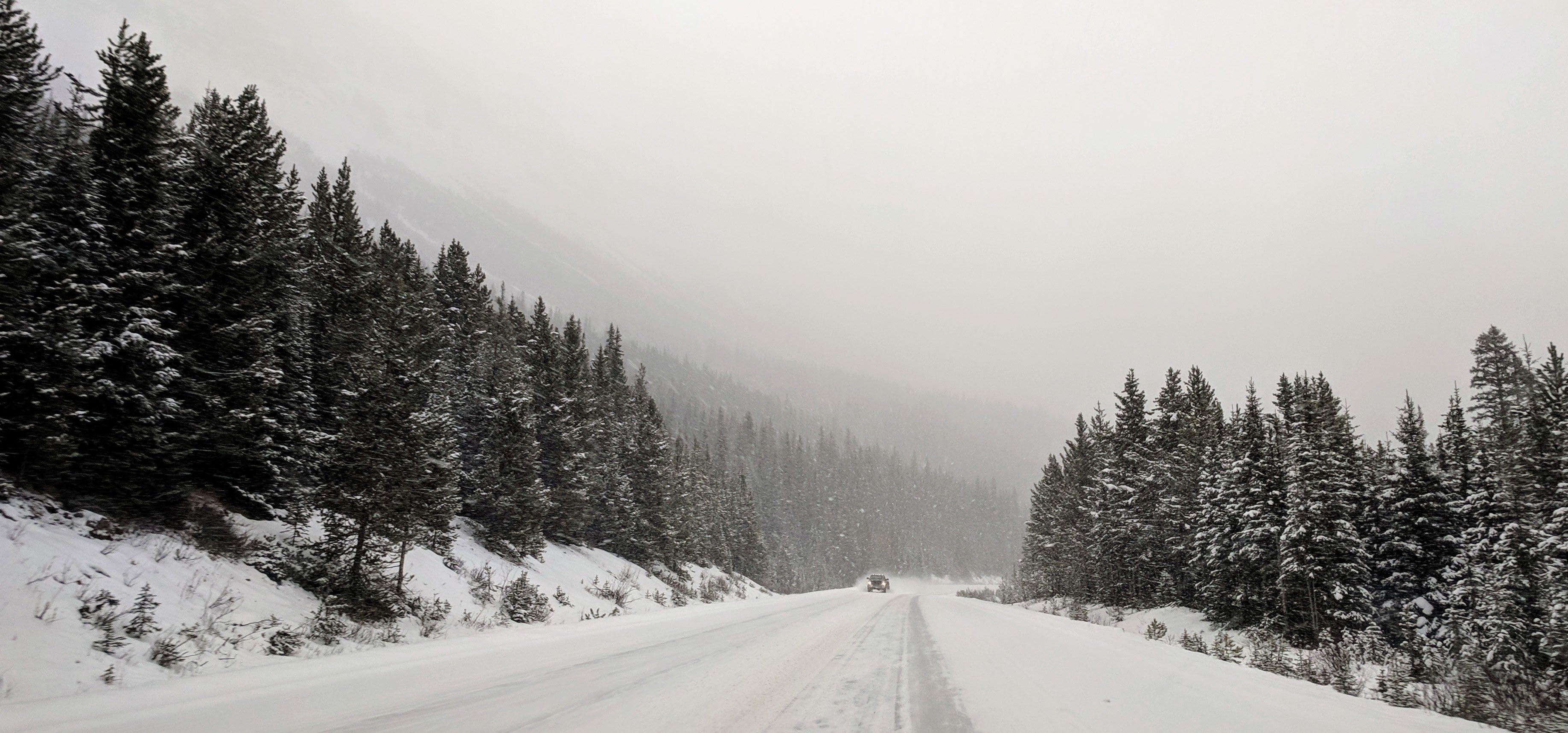 a-single-truck-on-a-snowy-road.jpg