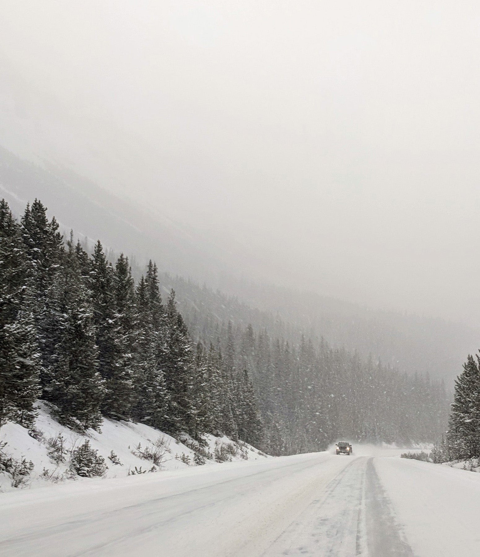 a-single-truck-on-a-snowy-road.jpg